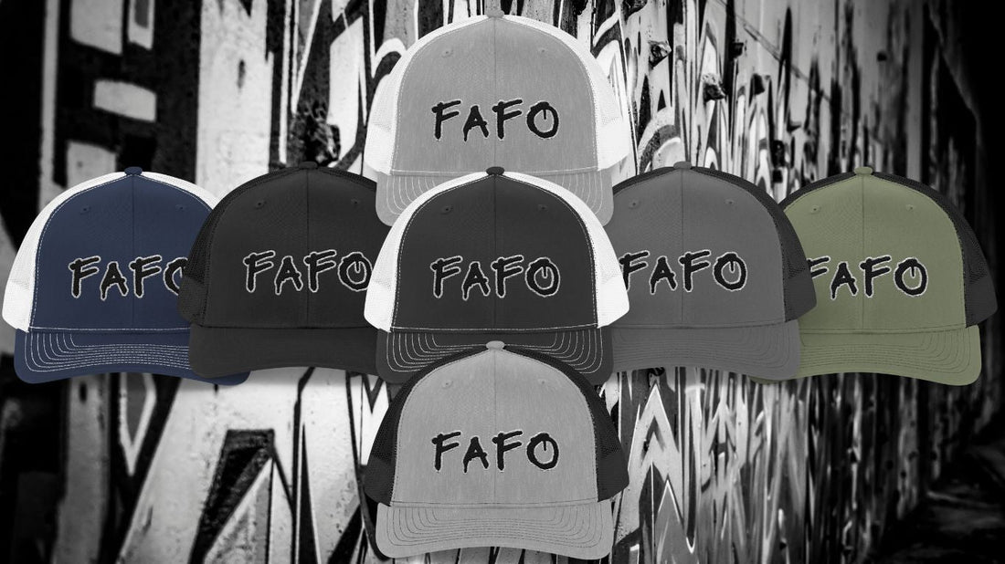 A collection of FAFO trucker hats in various color combinations, featuring bold embroidered lettering in a spray paint-style font, displayed against a graffiti-covered urban wall background.