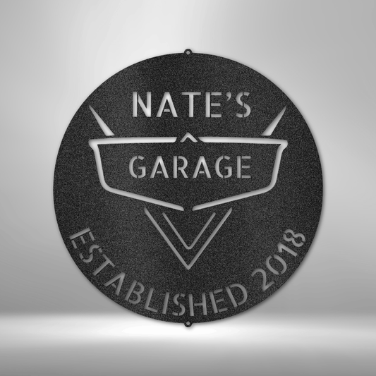 Customizable garage metal sign, featuring a classic retro automotive emblem design with personalized name and establishment year. Made from 16-gauge steel, powder-coated for durability. Available in black, copper, bronze, silver, and white.