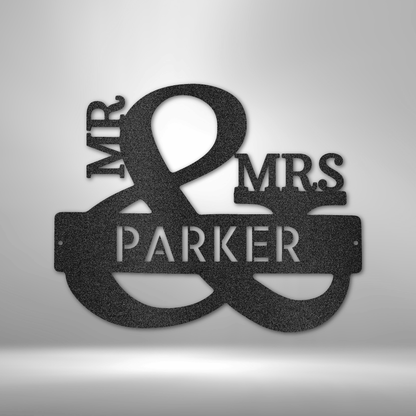 Custom Mr. & Mrs. metal sign featuring an elegant ampersand design with a personalized last name. Crafted from 16-gauge steel with a durable powder-coated finish. Available in black, copper, bronze, silver, and white.