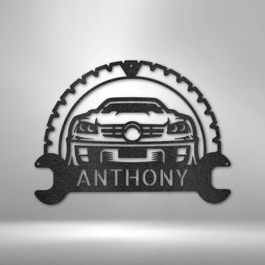 Custom steel garage sign featuring a sports car design with a wrench and gear frame, personalized with a name—perfect for mechanics and car lovers.