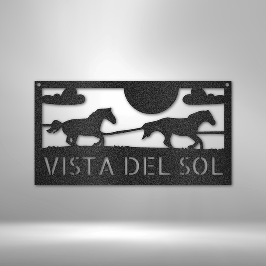 Custom metal ranch sign featuring two galloping horses against a scenic backdrop with a sun and clouds, personalized with the name "Vista Del Sol." Available in Black, Copper, Bronze, Silver, and White.