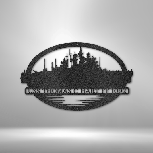 Customizable US Navy warship metal sign, featuring an oval-framed silhouette of a battleship with customizable ship names. Personalize with one of nine different warships and text. Made from 16-gauge steel, powder-coated for durability. Available in black, copper, bronze, silver, and white.