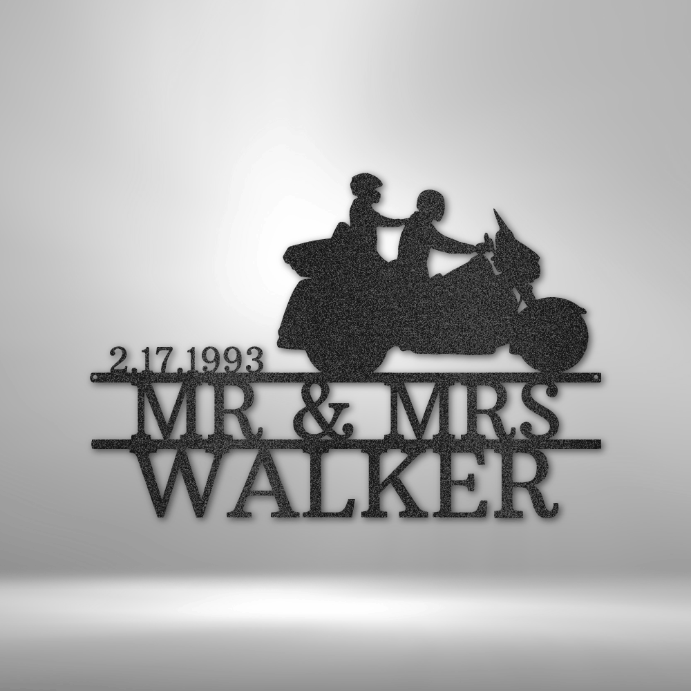 Custom steel wall sign featuring a silhouette of a motorcycle couple, personalized with last name and anniversary date. Made from 16-gauge steel, powder-coated for durability, and available in Black, Silver, White, Copper, and Bronze finishes.