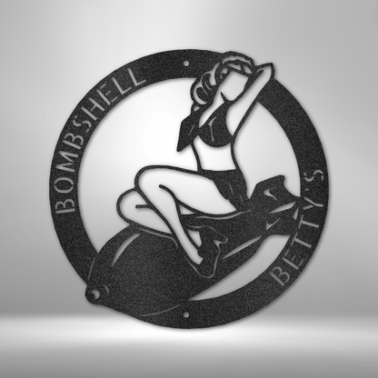 Custom Bombshell Betty’s Pin-Up Steel Sign featuring a vintage pin-up girl sitting atop a bomb. Personalizable with custom text. Made from 16-gauge steel, powder-coated for durability, and available in Black, Silver, White, Copper, and Bronze finishes.